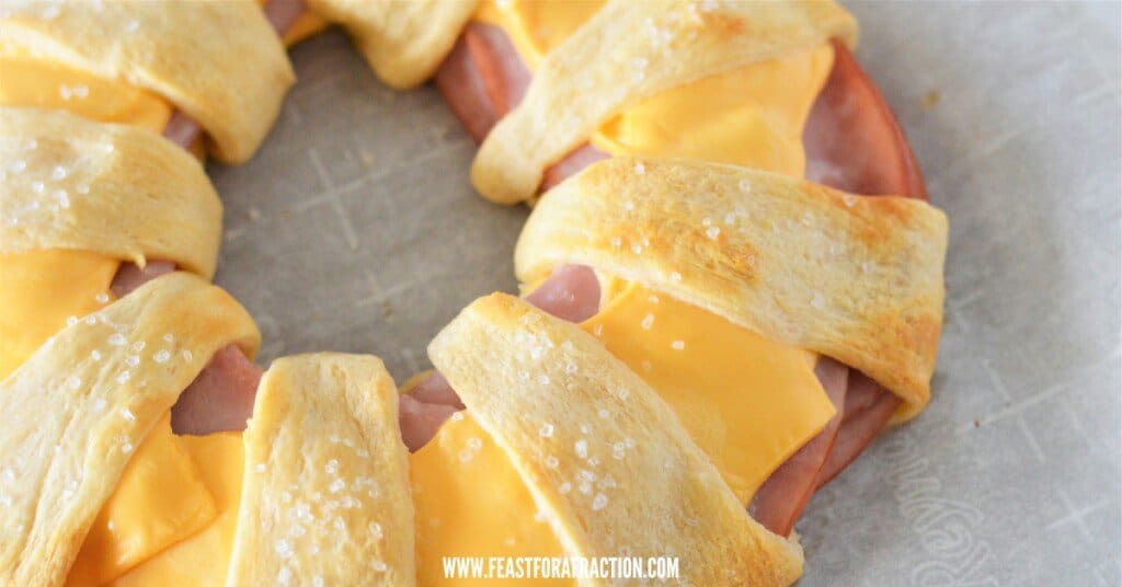 close up horizontal view of ham and cheese baked in crescent roll ring